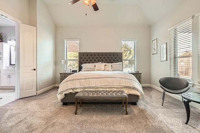 carpeted bedroom featuring vaulted ceiling, sink, and ceiling fan