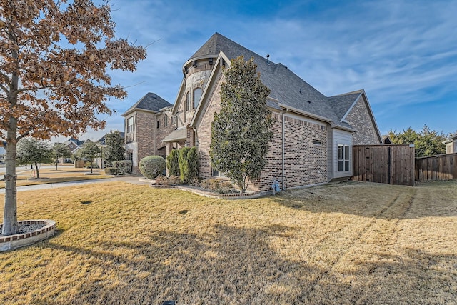 view of property exterior featuring a lawn