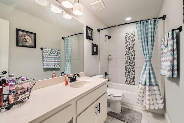 full bathroom featuring tile patterned flooring, shower / bath combo, vanity, and toilet