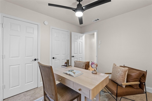 office with light colored carpet and ceiling fan