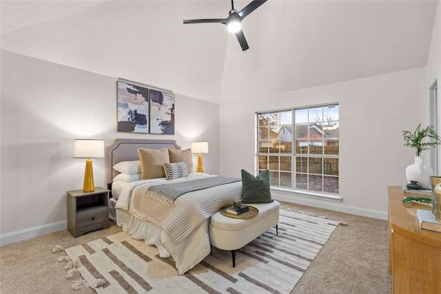 bedroom with vaulted ceiling, ceiling fan, and carpet floors