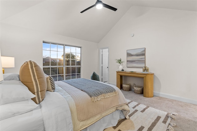 bedroom with ceiling fan, carpet flooring, and high vaulted ceiling