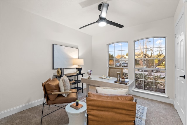 carpeted office space featuring a wealth of natural light and ceiling fan