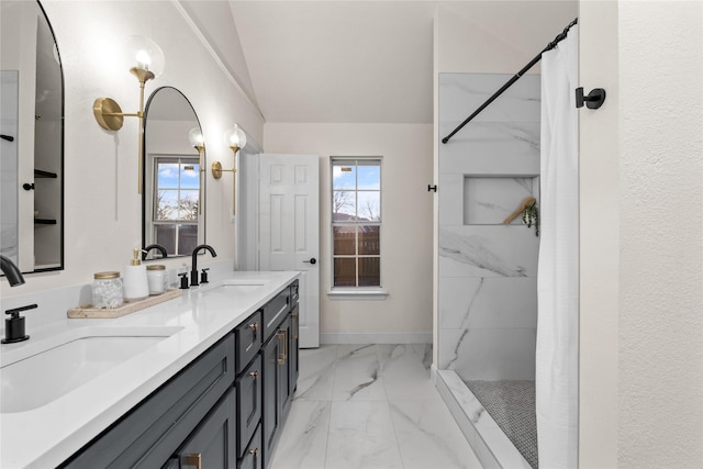 bathroom featuring vanity and curtained shower