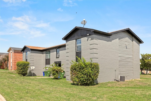 view of home's exterior featuring a yard