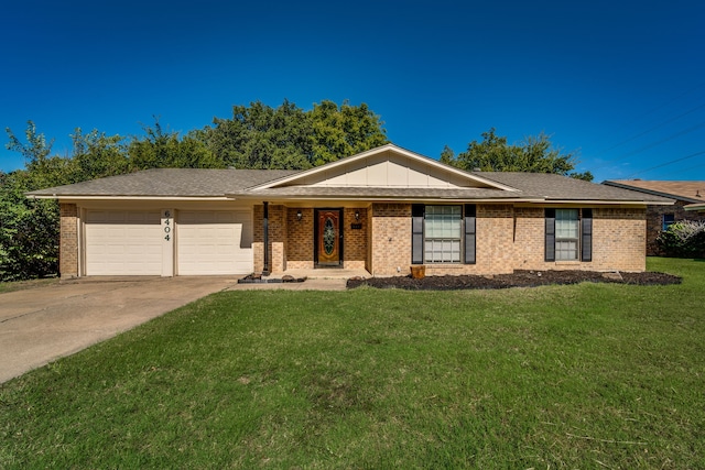 ranch-style home featuring a garage and a front lawn