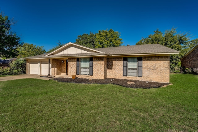 single story home featuring a garage and a front lawn