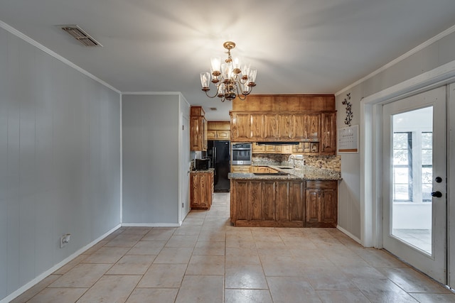 kitchen with black fridge, stainless steel oven, ornamental molding, and kitchen peninsula