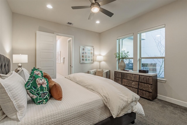 bedroom featuring ensuite bath, ceiling fan, and carpet