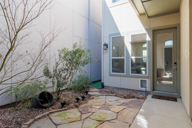 doorway to property featuring a patio