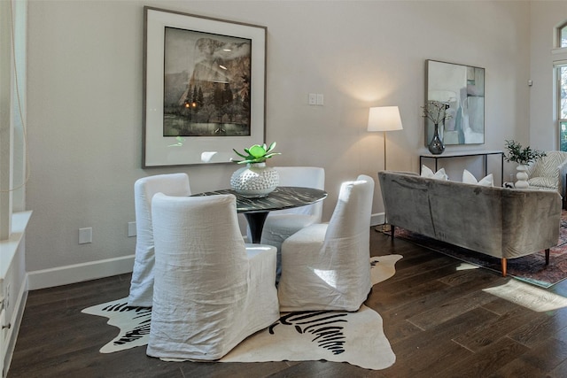 dining area featuring dark hardwood / wood-style floors