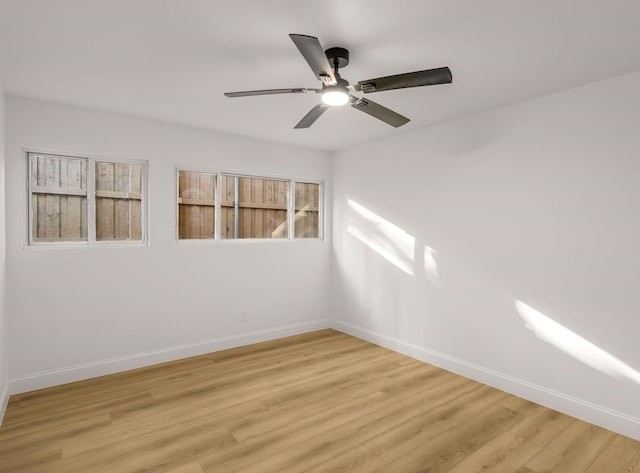 unfurnished room featuring ceiling fan and light wood-type flooring