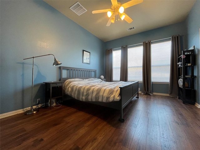 bedroom featuring ceiling fan, lofted ceiling, and dark hardwood / wood-style flooring