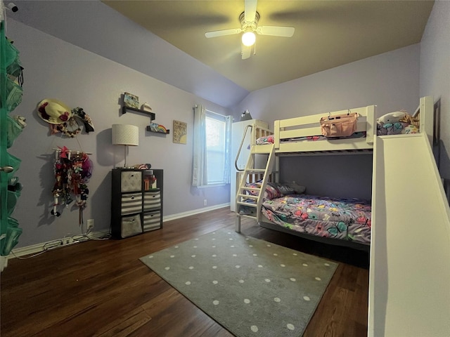 bedroom with ceiling fan, lofted ceiling, and dark hardwood / wood-style floors