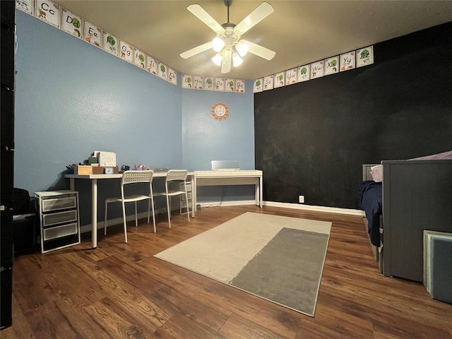 office space with ceiling fan and dark hardwood / wood-style floors