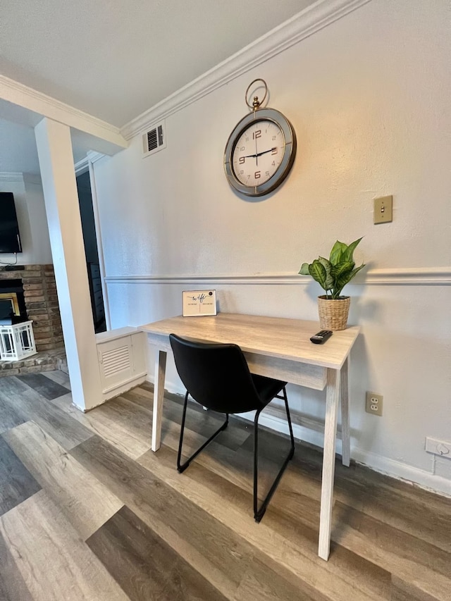 office featuring ornamental molding and hardwood / wood-style floors