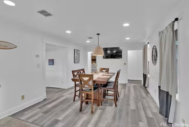 dining space featuring hardwood / wood-style floors