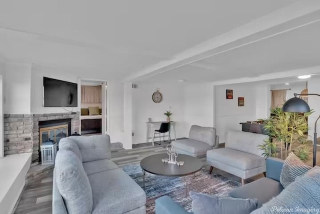 living room with hardwood / wood-style flooring and beamed ceiling