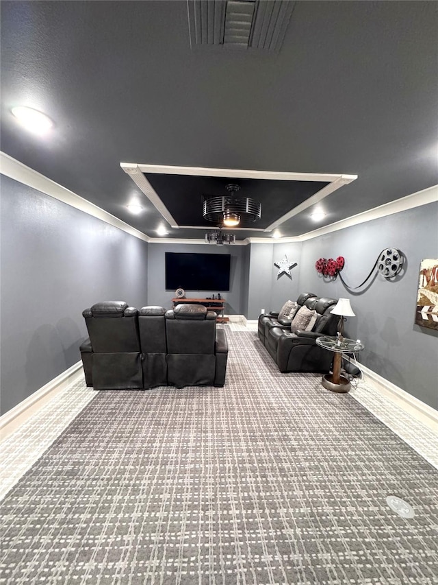 cinema featuring crown molding and carpet flooring