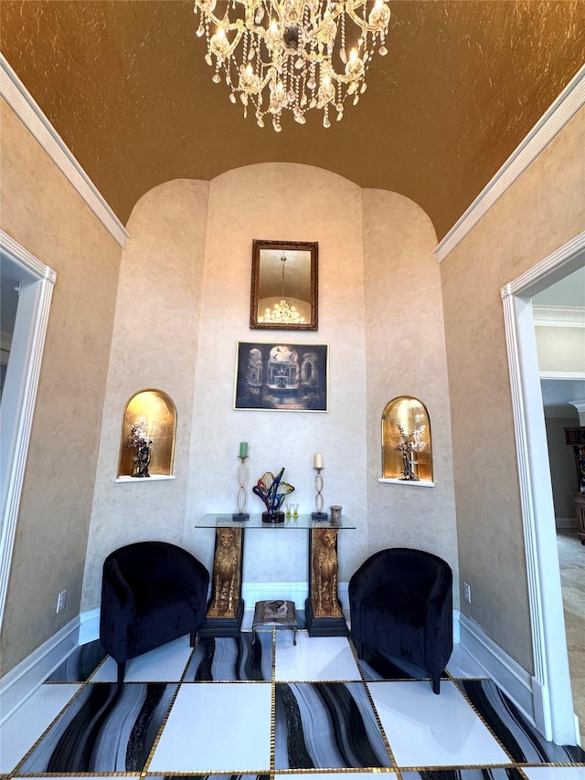 living room with ornamental molding and a notable chandelier