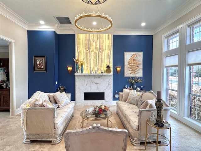 living room with ornamental molding and a premium fireplace