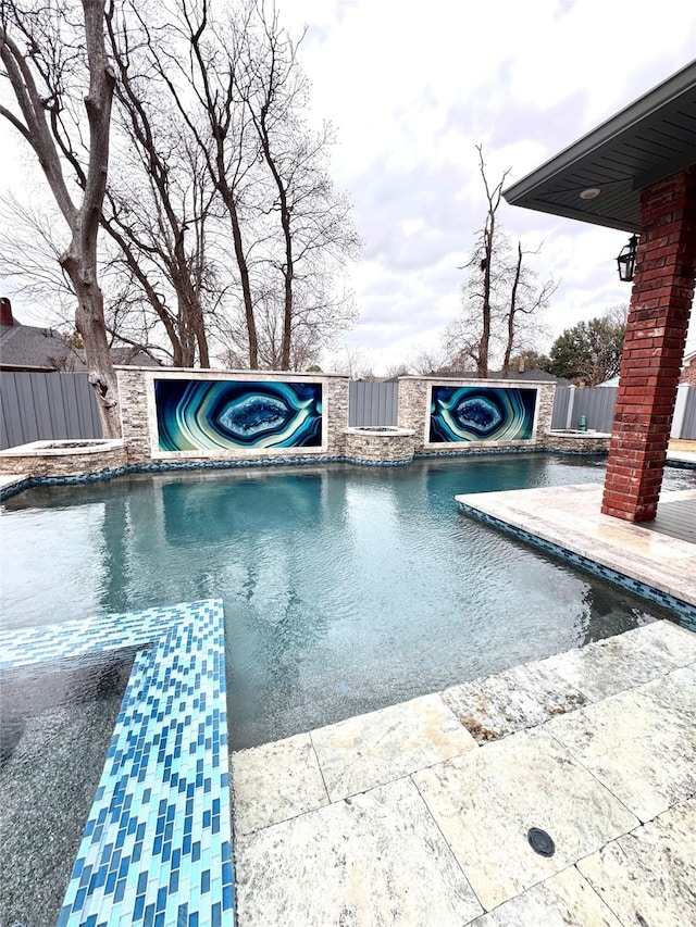 view of swimming pool with a patio and an in ground hot tub