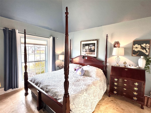 bedroom featuring lofted ceiling