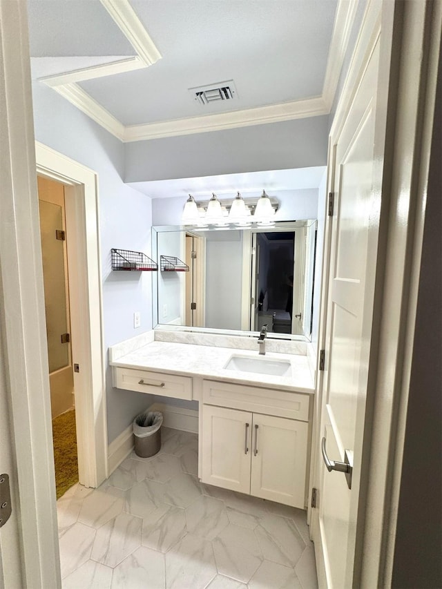 bathroom with vanity and ornamental molding