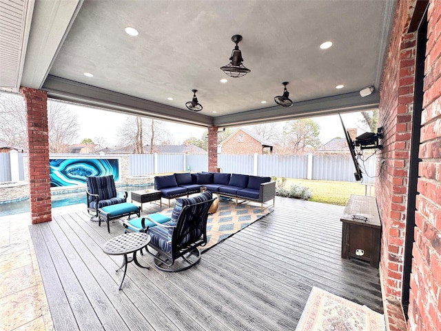 deck with a pool and an outdoor living space