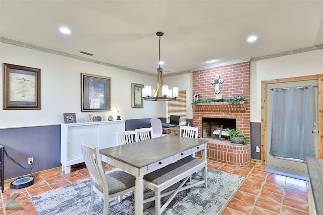 tiled dining area with ornamental molding and a brick fireplace