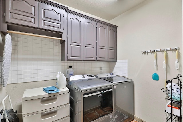 laundry area featuring cabinets and independent washer and dryer