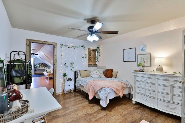 bedroom with hardwood / wood-style floors and ceiling fan