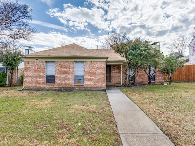 single story home featuring a front yard