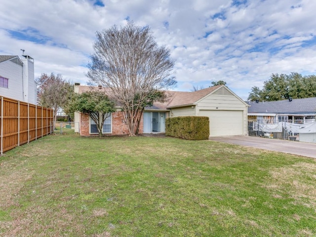 view of front facade with a garage and a front yard