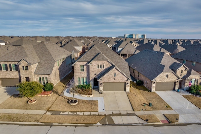 birds eye view of property with a residential view