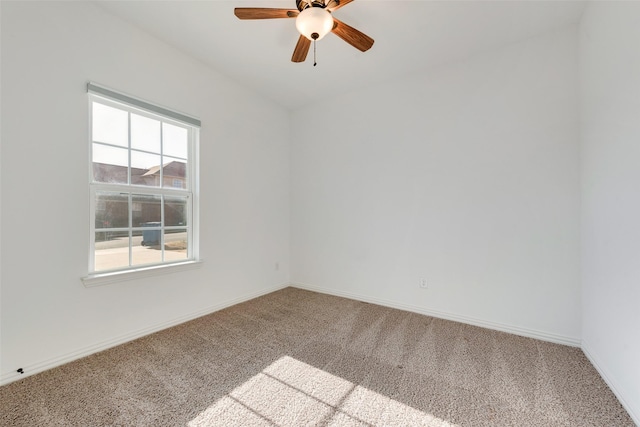 spare room featuring carpet floors and ceiling fan