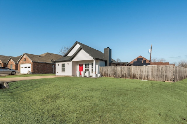 view of front of home featuring a garage and a front yard