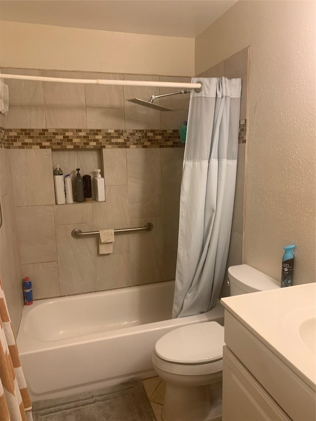 full bathroom with vanity, shower / tub combo with curtain, and toilet