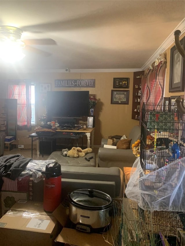 living room featuring crown molding and ceiling fan