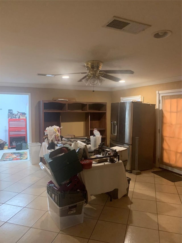 dining room featuring light tile patterned flooring, ceiling fan, and crown molding