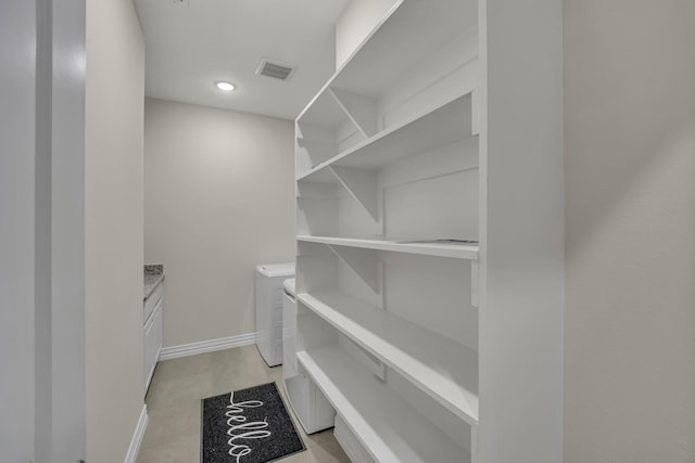 spacious closet featuring washing machine and dryer