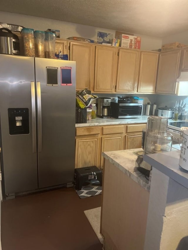 kitchen featuring stainless steel fridge, exhaust hood, a textured ceiling, and light brown cabinets