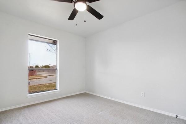 carpeted empty room with ceiling fan