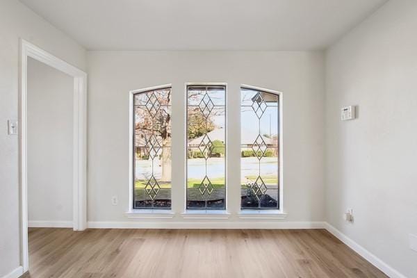 unfurnished room featuring light hardwood / wood-style floors