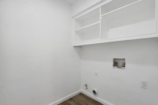 washroom featuring electric dryer hookup, hookup for a gas dryer, hookup for a washing machine, and dark hardwood / wood-style floors