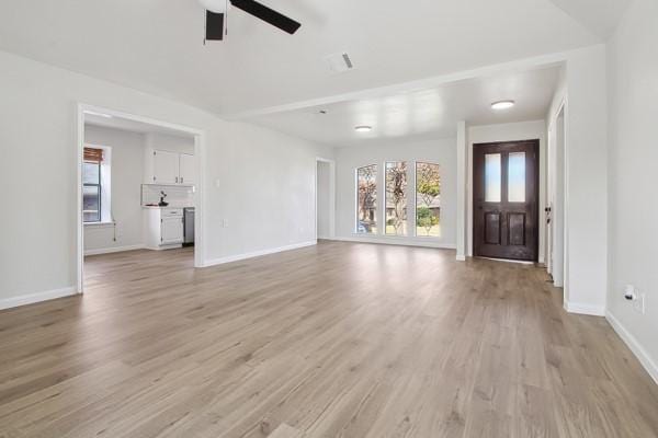 unfurnished living room with light hardwood / wood-style floors and ceiling fan