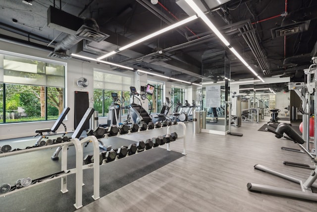 workout area with wood-type flooring