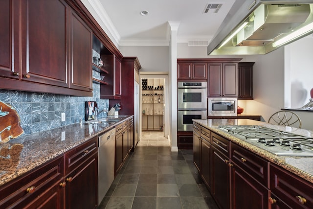 kitchen featuring light stone counters, stainless steel appliances, sink, and island range hood