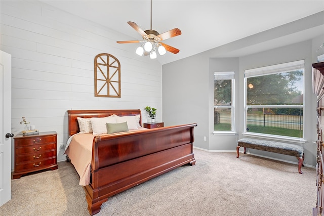 carpeted bedroom with lofted ceiling and ceiling fan