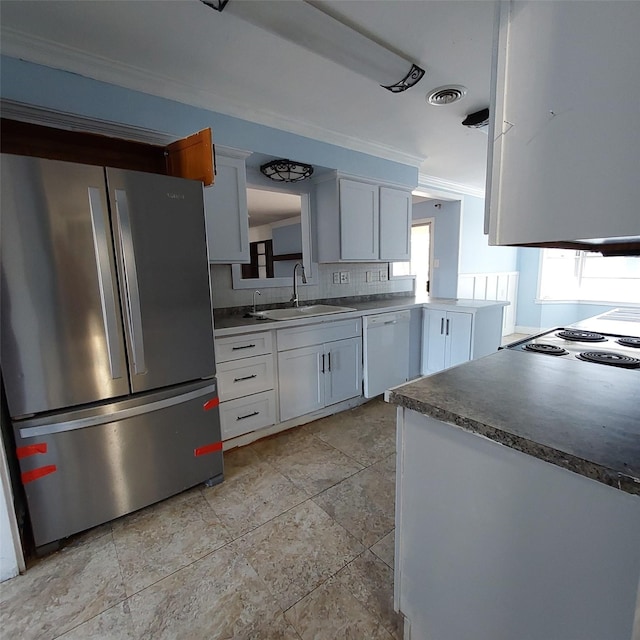 kitchen with sink, stainless steel refrigerator, white cabinetry, white dishwasher, and ornamental molding